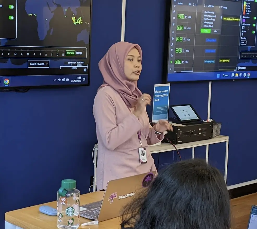 Photo of Palmoil.io team member giving a presentation